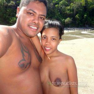 A nudists with cool tattoos outside